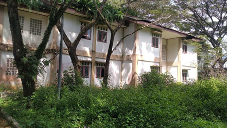 3D rendering of modern high-rise building with glass façade and complex geometric shapes